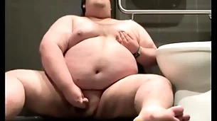 Chubby plays in public bathroom