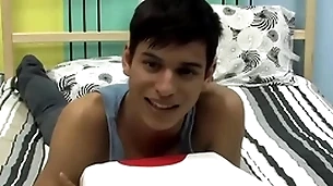 Cute twink is playing with his cock by way of an interview