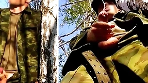 Russian soldier about a big dick on a military mission in the forest shoots sperm from his penis at opponents